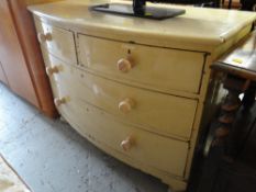 A bow-fronted painted chest of drawers, two short above two long