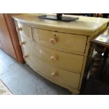 A bow-fronted painted chest of drawers, two short above two long