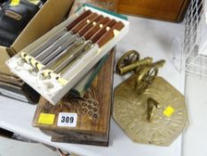 Carved topped wooden wine box, boxed knives, brass sundial & cannon