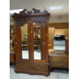 Parcel of bedroom furniture to include an Edwardian double mirror doored and carved wardrobe