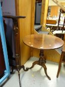 A nice antique oak tilt-top occasional table on tripod feet together with a modern reproduction