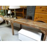 A long narrow wooden work table