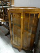 Vintage light oak bow-fronted display cabinet