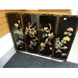 Four black lacquered Chinese panels with birds & foliage in relief