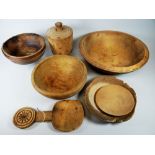 A PARCEL OF WELSH FARMHOUSE TREEN including butter-pat, butter scoop and bowls Provenance: by