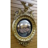 AN EMPIRE PERIOD GILT WOOD CONVEX MIRROR FROM THE HOME OF DAVID LLOYD GEORGE having a reeded black