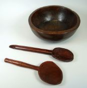 A LARGE WELSH ELM BOWL WITH TWO PRIMITIVE LADLES, the bowls with continuous turn decoration, 28cms