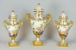 A FINE GARNITURE TRIO OF COVERED VASES DECORATED BY WILLIAM POLLARD, possibly for H & R Daniel,