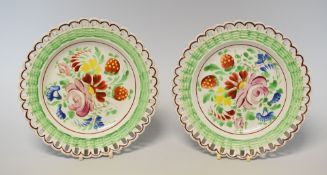 A PAIR OF GLAMORGAN POTTERY PLATES WITH ARCADED BORDER the rims with green painted basket-weave
