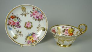A FINE NANTGARW CUP & SAUCER fully painted with large sprays of flowers and gold anthemion, the