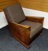 A BRYNMAWR FURNITURE JOINED OAK ARMCHAIR with two cushions and on original casters, 89cms deep