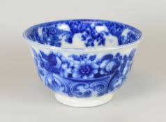 A LLANELLY W D HOLLAND PERIOD BOWL of footed form with deep sides and decorated in the flow blue '