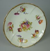 A SWANSEA PORCELAIN CRUCIFORM CIRCULAR DISH finely painted with a full centre floral spray of