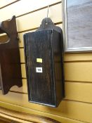 An antique oak hanging candle box