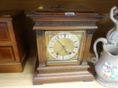 A German mahogany encased architectural mantel clock with brass dial