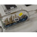 Vintage ship in bottle with inscription to the base outlining the ship
