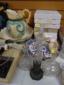 An unusual cut glass oil bottle on a metal work architectural stand, a pair of globular