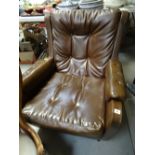 A retro brown leather-effect armchair