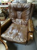 A retro brown leather-effect armchair