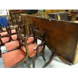 A reproduction twin-pedestal dining table & eight chairs