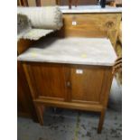 A vintage marble topped compact wash stand with railback