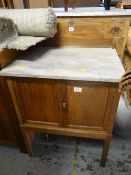 A vintage marble topped compact wash stand with railback