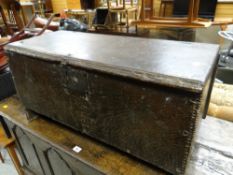 An eighteenth century plank oak coffer with old iron lock & hinges and of primitive form