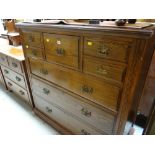 A pitch pine chest in the Scottish style formed of three long, four short & middle hat drawer