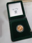 A 1980 cased gold full sovereign