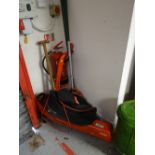 A Flymo garden vac, strimmer, garden rakes etc