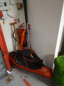 A Flymo garden vac, strimmer, garden rakes etc