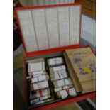 A box of cigarette cards, mainly loose