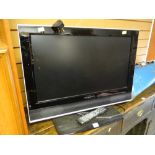 A Wharfdale flatscreen TV & remote control