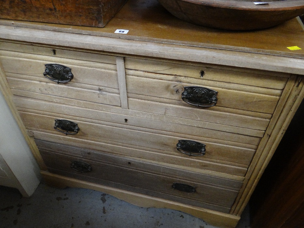 A lightwood vintage chest of two long & two short drawers