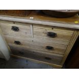 A lightwood vintage chest of two long & two short drawers