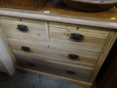 A lightwood vintage chest of two long & two short drawers