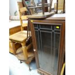 A narrow single-door glazed bookcase, an Ercol spindle back chair & a coffee table etc