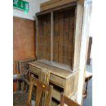 A lightwood dresser with glass doors (for assembly)