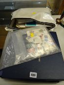 A quantity of loose stamps, First Day Covers & a boxed Bradford Exchange concord cake stand