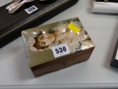 A charming portrait miniature musical box