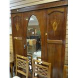 An inlaid mahogany wardrobe with base drawer & oval centre mirror