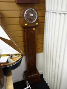 A vintage polished grandmother clock