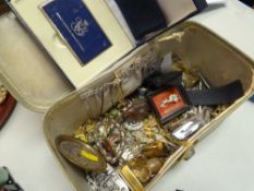 A vintage vanity box with costume jewellery contents