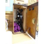 A vintage Beck laboratory microscope in a wooden case