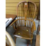 A stained antique Windsor elbow chair