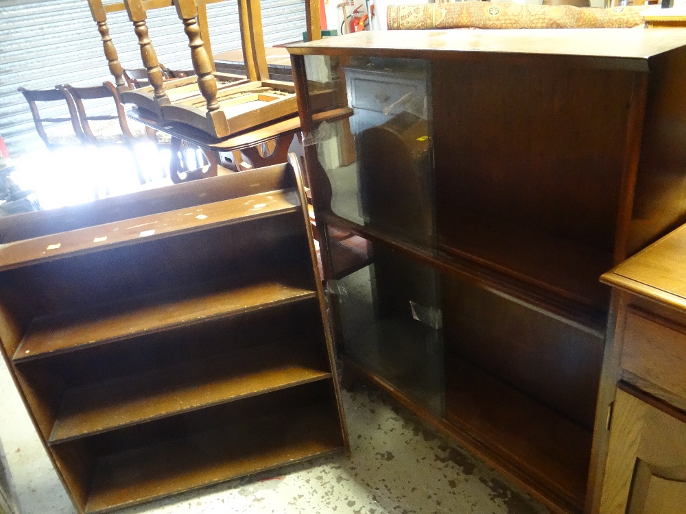 An open bookcase & a sliding door bookcase