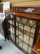 A two-door bow front railback china cabinet