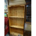 A modern pine adjustable open bookcase
