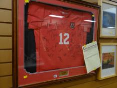 A signed replica Wales International Football shirt (framed) presented by John Robinson circa 2005