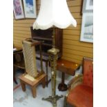 An elaborate tripod brass standard lamp & shade